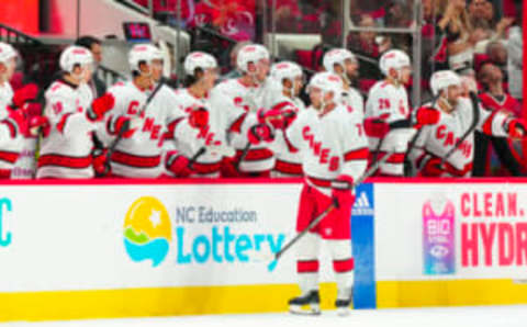 Sep 26, 2023; Raleigh, North Carolina, USA; Carolina Hurricanes defenseman Tony DeAngelo (77) celebrates his goal against the Tampa Bay Lightning during the second period at PNC Arena. Mandatory Credit: James Guillory-USA TODAY Sports