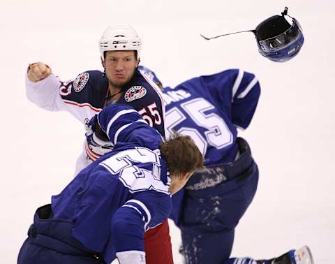 LEAFS BLUEJACKETS. 10,05, 2008 .Toronto Maple Leafs Alexei Ponikarovski gets punched by Ole Kristian Tollefsen of the Blue Jackets after he drilled Jason Blake ( rear) in an open ice hit in the first at the ACC on Sunday . Rene Johnston/Toronto Star (Photo by Rene Johnston/Toronto Star via Getty Images)