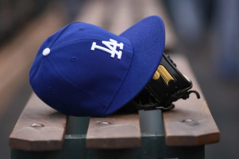 DENVER, CO – MAY 01: Detail photo of a cap and glove of a player from the Los Angeles Dodgers prior to facing the Colorado Rockies at Coors Field on May 1, 2012 in Denver, Colorado. (Photo by Doug Pensinger/Getty Images)