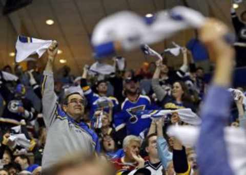 Apr 18, 2015; St. Louis, MO, USA; St. Louis Blues fans waive rally towels during the game between the St. Louis Blues and the Minnesota Wild during the first period in game two of the first round of the the 2015 Stanley Cup Playoffs at Scottrade Center. Mandatory Credit: Jasen Vinlove-USA TODAY Sports