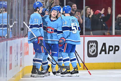 MONTREAL, CANADA – JANUARY 26: Michael Pezzetta #55 of the Montreal Canadiens celebrates his goal with teammates Arber Xhekaj #72 and Jordan Harris #54 during the first period of the game against the Detroit Red Wings at Centre Bell on January 26, 2023 in Montreal, Quebec, Canada. (Photo by Minas Panagiotakis/Getty Images)