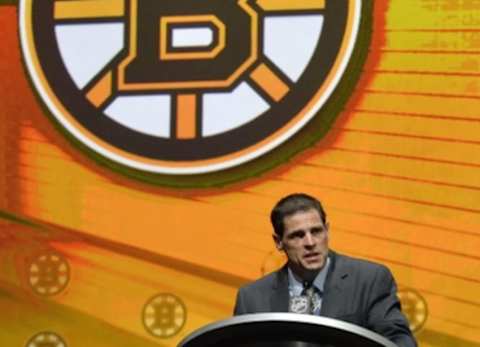 Jun 26, 2015; Sunrise, FL, USA; Boston Bruins general manager Don Sweeney makes the first of three consecutive draft picks in the first round of the 2015 NHL Draft at BB&T Center. Mandatory Credit: Steve Mitchell-USA TODAY Sports