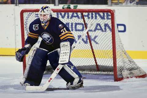 Daren Puppa #31 from Canada and Goaltender for the Buffalo Sabres looks on from in front of the goal post during the NHL Prince of Wales Conference Adams Division game against the Detroit Red Wings on 12th February 1992 at the Buffalo Memorial Auditorium in Buffalo, New York, United States. The Detroit Red Wings won the game 9 – 4. (Photo by Harry Scull Jr./Allsport/Getty Images)