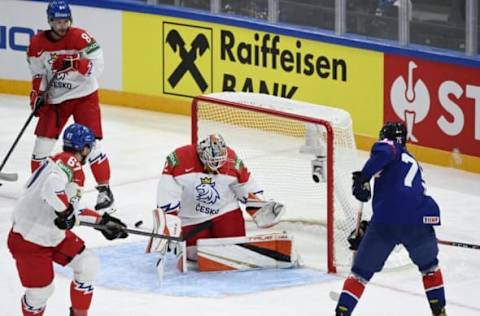 (Bottom L-R) Czech Republic’s forward Jiri Smejkal, Czech Republic’s goalkeeper Lukas Dostal, and Great Britain’s forward Robert Lachowicz vie for the puck during the IIHF Ice Hockey World Championships 1st Round group B match between the Czech Republic and Great Britain at the Nokia Arena in Tampere, Finland, on May 14, 2022. – Finland OUT (Photo by Emmi Korhonen / Lehtikuva / AFP) / Finland OUT (Photo by EMMI KORHONEN/Lehtikuva/AFP via Getty Images)