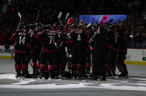 RALEIGH, NC – MARCH 01: A Bunch of Jerks celebrate at center ice after a game between the St. Louis Blues and the Carolina Hurricanes at the PNC Arena in Raleigh, NC on March 1, 2019. (Photo by Greg Thompson/Icon Sportswire via Getty Images)