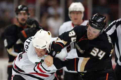 ANAHEIM, CA: James Wisniewski #34 of the Anaheim Ducks punches Nick Boynton #24 of the Chicago Blackhawks during their fight in the third period at the Honda Center on March 17, 2010. (Photo by Victor Decolongon/Getty Images)