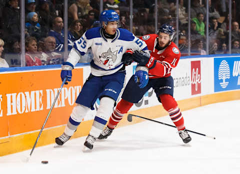 OSHAWA, ON – FEBRUARY 7: Quinton Byfield #55 of the Sudbury Wolves protects the puck from Giovanni Vallati #11 of the Oshawa Generals during an OHL game at the Tribute Communities Centre on February 7, 2020 in Oshawa, Ontario, Canada. (Photo by Chris Tanouye/Getty Images)