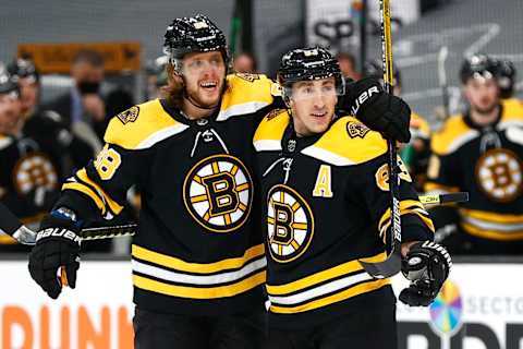 BOSTON, MASSACHUSETTS – MARCH 11: David Pastrnak #88 of the Boston Bruins celebrates with Brad Marchand #63 after scoring a goal against the New York Rangers during the first period at TD Garden on March 11, 2021 in Boston, Massachusetts. (Photo by Maddie Meyer/Getty Images)