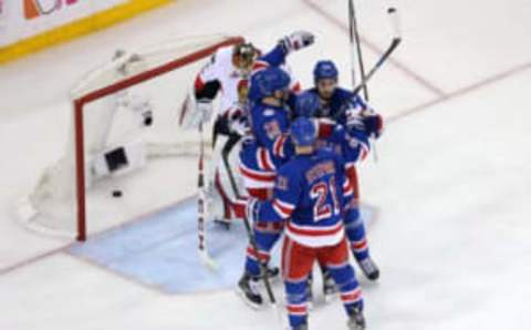 May 4, 2017; New York, NY, USA; New York Rangers left wing Chris Kreider (20) celebrates after scoring a goal against Ottawa Senators goalie Mike Condon (1) with teammates during the third period of game four of the second round of the 2017 Stanley Cup Playoffs at Madison Square Garden. Mandatory Credit: Brad Penner-USA TODAY Sports