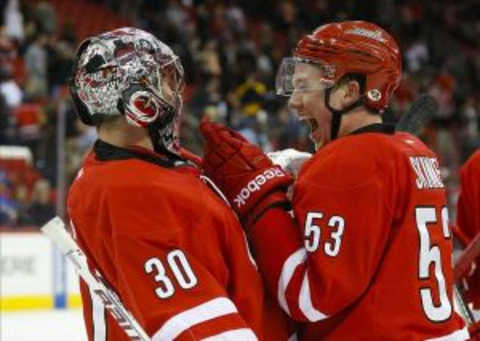 Mar 13, 2014; Raleigh, NC, USA; Carolina Hurricanes goalie Cam Ward (30) is congratulated by teammate forward Jeff Skinner (53) after the game against the Buffalo Sabres at PNC Arena. The Carolina Hurricanes defeated the Buffalo Sabres 4-2. Mandatory Credit: James Guillory-USA TODAY Sports