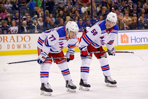 COLUMBUS, OH – NOVEMBER 10: Tony DeAngelo #77 of the New York Rangers and Lias Andersson #50 line up for a face off during the game against the Columbus Blue Jackets on November 10, 2018 at Nationwide Arena in Columbus, Ohio. (Photo by Kirk Irwin/Getty Images)