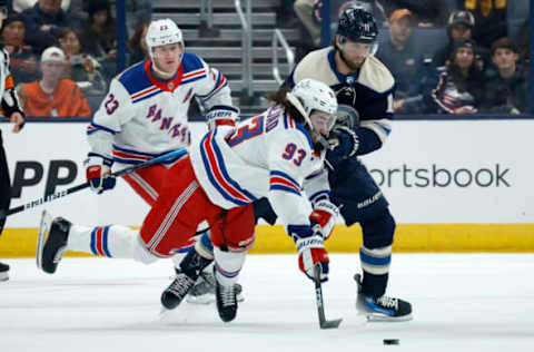 COLUMBUS, OHIO – OCTOBER 14: Mika Zibanejad #93 of the New York Rangers is knocked down by Adam Fantilli #11 of the Columbus Blue Jackets while battling for control of the puck during the first period of the game at Nationwide Arena on October 14, 2023, in Columbus, Ohio. (Photo by Kirk Irwin/Getty Images)