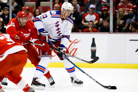 Mar 12, 2017; Detroit, MI, USA; New York Rangers center Kevin Hayes (13) skates with the puck defended by Detroit Red Wings right-wing Gustav Nyquist (14) in the second period at Joe Louis Arena. Mandatory Credit: Rick Osentoski-USA TODAY Sports