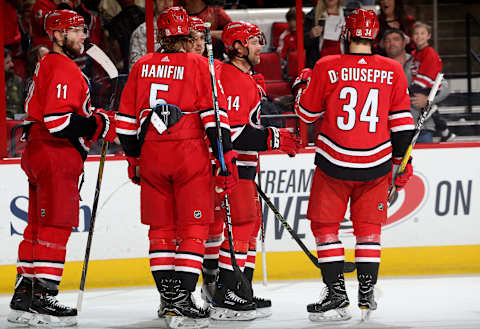 RALEIGH, NC – APRIL 7: Justin Williams #14 of the Carolina Hurricanes celebrates with teammates Jordan Staal #11, Noah Hanifin #5 and Phillip Di Giuseppe #34 after scoring a goal during an NHL game against the Tampa Bay Lightning on April 7, 2018 at PNC Arena in Raleigh, North Carolina. (Photo by Gregg Forwerck/NHLI via Getty Images)