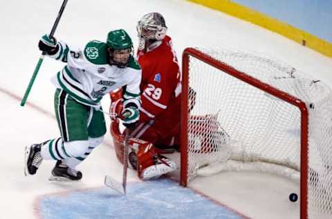 Apr 9, 2015; Boston, MA, USA; University of North Dakota defenseman Troy Stecher (2) reacts after scoring a goal on Boston University Terriers goalie Matt O’Connor (29) during the third period in a semifinal game in the men’s Frozen Four college ice hockey tournament at TD Garden. Mandatory Credit: Greg M. Cooper-USA TODAY Sports