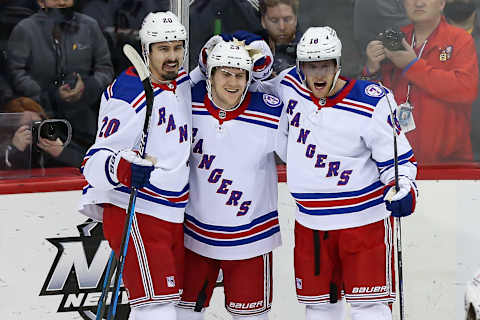 Mar 22, 2022; Newark, New Jersey, USA; New York Rangers defenseman Adam Fox (23) is congratulated by New York Rangers defenseman Adam Fox (23) and New York Rangers center Andrew Copp (18) (Credit: Tom Horak-USA TODAY Sports)