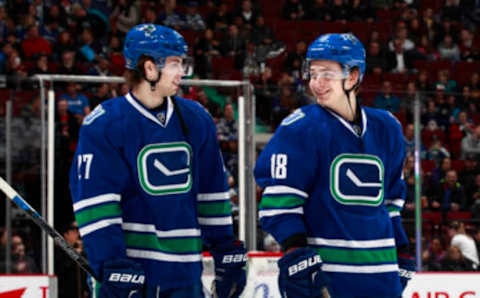 VANCOUVER, BC – MARCH 14: Jake Virtanen #18 and Ben Hutton #27 of the Vancouver Canucks talk as they skate up ice during their NHL game against the Winnipeg Jets at Rogers Arena March 14, 2016 in Vancouver, British Columbia, Canada. (Photo by Jeff Vinnick/NHLI via Getty Images)