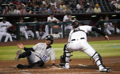 Randal Grichuk slides for home. Joe Camporeale-USA TODAY Sports