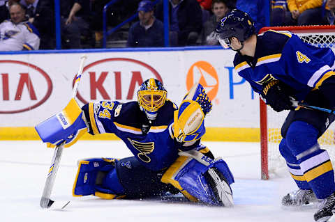 Mar 27, 2017; St. Louis, MO, USA; St. Louis Blues goalie Jake Allen (34) makes a glove save against the Arizona Coyotes during the first period at Scottrade Center. Mandatory Credit: Jeff Curry-USA TODAY Sports