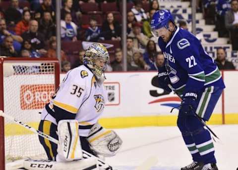 Mar 12, 2016; Vancouver, British Columbia, CAN; Nashville Predators goaltender Pekka Rinne (35) defends against Vancouver Canucks forward Daniel Sedin (22) during the first period at Rogers Arena. Mandatory Credit: Anne-Marie Sorvin-USA TODAY Sports