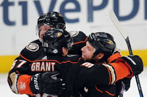 ANAHEIM, CA – FEBRUARY 25: Anaheim Ducks center Derek Grant (38) and captain Ryan Getzlaf (15) celebrate with center Rickard Rakell (67) after Rakell scored a game-tying goal for a hat trick with seconds left in the third period of a game against the Edmonton Oilers played on February 25, 2018, at the Honda Center in Anaheim, CA. (Photo by John Cordes/Icon Sportswire via Getty Images)