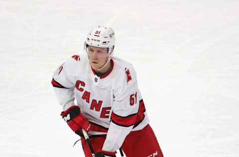 CHICAGO, ILLINOIS – FEBRUARY 04: Jake Gardiner #51 of the Carolina Hurricanes looks to pass against the Chicago Blackhawksat the United Center on February 04, 2021 in Chicago, Illinois. The Blackhawks defeated the Hurricanes 6-4. (Photo by Jonathan Daniel/Getty Images)