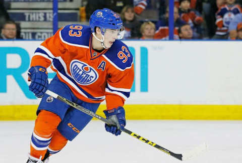 Jan 16, 2016; Edmonton, Alberta, CAN; Edmonton Oilers forward Ryan Nugent-Hopkins (93) carries the puck against the Calgary Flames at Rexall Place. Mandatory Credit: Perry Nelson-USA TODAY Sports