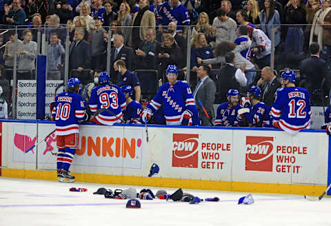 Jan 22, 2022; New York, New York, USA; Rangers fans throw hats on the ice to celebrate a hat trick by New York Rangers left wing Chris Kreider (20) during the third period against the Arizona Coyotes at Madison Square Garden. Mandatory Credit: Danny Wild-USA TODAY Sports