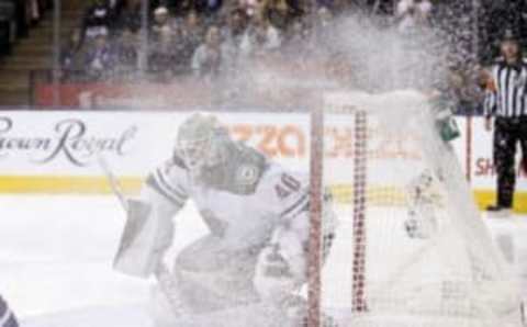 Dec 7, 2016; Toronto, Ontario, CAN; Minnesota Wild goaltender Devan Dubnyk (40) tries to follow the puck through a spray of ice against the Toronto Maple Leafs at the Air Canada Centre. Minnesota defeated Toronto 3-2. Mandatory Credit: John E. Sokolowski-USA TODAY Sports