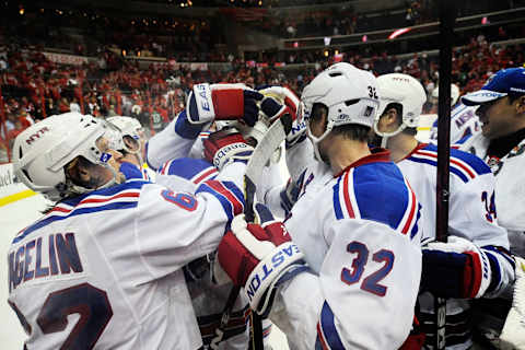 The New York Rangers celebrate after Marian Gaborik #10 scored the game winning goal. (Photo by Patrick McDermott/Getty Images)