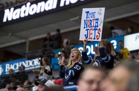 Jan 7, 2016; Dallas, TX, USA; Winnipeg Jets fans celebrate the goal by the Jets during the second period of the game against the Dallas Stars at the American Airlines Center. Mandatory Credit: Jerome Miron-USA TODAY Sports