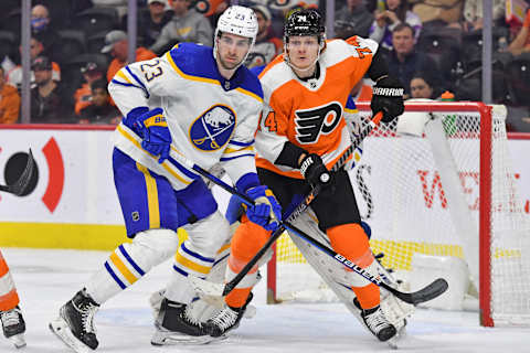 Apr 17, 2022; Philadelphia, Pennsylvania, USA; Buffalo Sabres defenseman Mattias Samuelsson (23) and Philadelphia Flyers right wing Owen Tippett (74) battle for position during the second period at Wells Fargo Center. Mandatory Credit: Eric Hartline-USA TODAY Sports