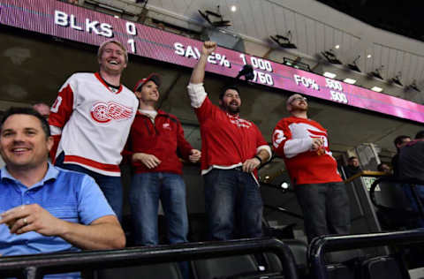 Mar 15, 2017; Denver, CO, USA; Detroit Red Wings fans react to a goal by center Andreas Athanasiou (72) in the first period against the Colorado Avalanche at Pepsi Center. Mandatory Credit: Ron Chenoy-USA TODAY Sports