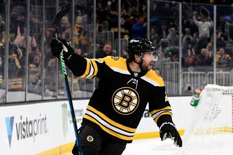 Mar 12, 2022; Boston, Massachusetts, USA; Boston Bruins center Craig Smith (12) celebrates after scoring a goal against the Arizona Coyotes during the first period at the TD Garden. Mandatory Credit: Brian Fluharty-USA TODAY Sports