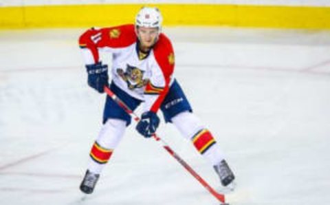 Jan 13, 2016; Calgary, Alberta, CAN; Florida Panthers center Jonathan Huberdeau (11) controls the puck against the Calgary Flames during the second period at Scotiabank Saddledome. Calgary Flames won 6-0. Mandatory Credit: Sergei Belski-USA TODAY Sports