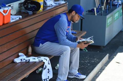 LOS ANGELES, CA – JUNE 28: Yu Darvish #11 of the Chicago Cubs looks over the team media guide as he sits in the dugout during the game against the Los Angeles Dodgers at Dodger Stadium on June 28, 2018 in Los Angeles, California. (Photo by Jayne Kamin-Oncea/Getty Images)