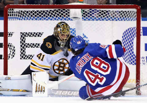 Jaroslav Halak #41 of the Boston Bruins makes the third period chest save on Brendan Lemieux #48 of the New York Rangers (Photo by Bruce Bennett/Getty Images)