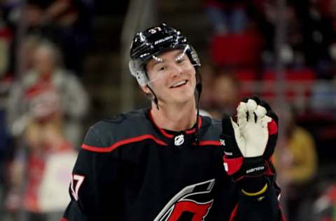 RALEIGH, NC – JANUARY 10: Andrei Svechnikov #37 of the Carolina Hurricanes waves at a fan during pregame warmup prior to an NHL game against the Arizona Coyotes on January 10, 2020 at PNC Arena in Raleigh, North Carolina. (Photo by Gregg Forwerck/NHLI via Getty Images)