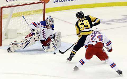 New York Rangers goaltender Igor Shesterkin (31) makes a save against Pittsburgh Penguins. Mandatory Credit: Charles LeClaire-USA TODAY Sports