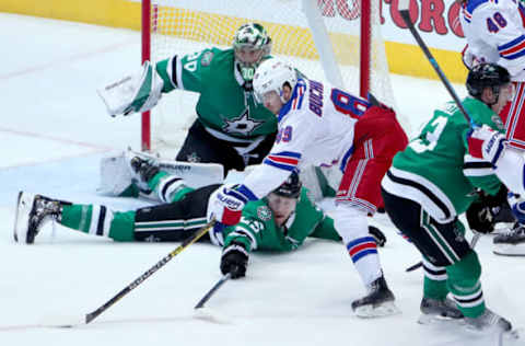 DALLAS, TEXAS – MARCH 05: Pavel Buchnevich #89 of the New York Rangers controls the puck against Ben Bishop #30 of the Dallas Stars and Brett Ritchie #25 of the Dallas Stars in the third period at American Airlines Center on March 05, 2019 in Dallas, Texas. (Photo by Tom Pennington/Getty Images)