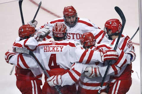 Apr 11, 2015; Boston, MA, USA; The Boston University Terriers surround forward Cason Hohmann (7) after his goal against the Providence College Friars during the second period in the championship game of the Frozen Four college ice hockey tournament at TD Garden. Mandatory Credit: Greg M. Cooper-USA TODAY Sports