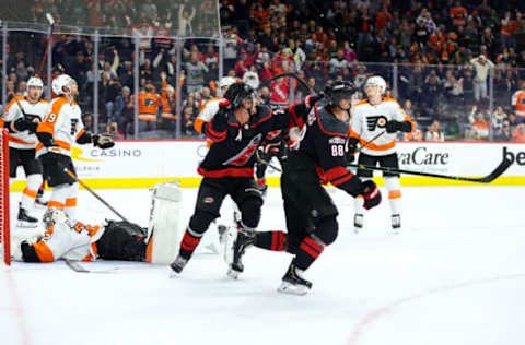 PHILADELPHIA, PENNSYLVANIA – MARCH 18: Sebastian Aho #20 and Martin Necas #88 of the Carolina Hurricanes celebrate a goal by Necas during the third period against the Philadelphia Flyers at Wells Fargo Center on March 18, 2023 in Philadelphia, Pennsylvania. (Photo by Tim Nwachukwu/Getty Images)