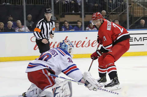 NEW YORK, NEW YORK – FEBRUARY 08: Nino Niederreiter #21 of the Carolina Hurricanes is stopped by Henrik Lundqvist #30 of the New York Rangers during the first period at Madison Square Garden on February 08, 2019 in New York City. (Photo by Bruce Bennett/Getty Images)