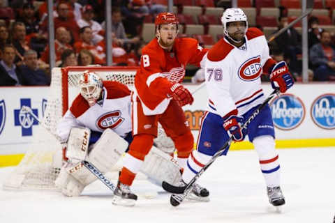 Nov 16, 2014; Detroit, MI, USA; Detroit Red Wings left wing Justin Abdelkader (8) and Montreal Canadiens defenseman P.K. Subban (76) fight for position with in front of goalie Dustin Tokarski (35) at Joe Louis Arena. Mandatory Credit: Rick Osentoski-USA TODAY Sports