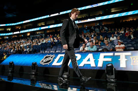 Cam Squire walks on stage after being selected by the New Jersey Devils. (Photo by Jeff Vinnick/NHLI via Getty Images)