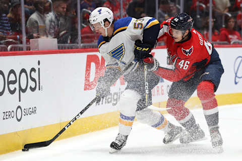 WASHINGTON, DC – SEPTEMBER 18: Austin Poganski #53 of the St. Louis Blues skates past Tobias Geisser #43 of the Washington Capitals during the first period of a preseason NHL game at Capital One Arena on September 18, 2019 in Washington, DC. (Photo by Patrick Smith/Getty Images)