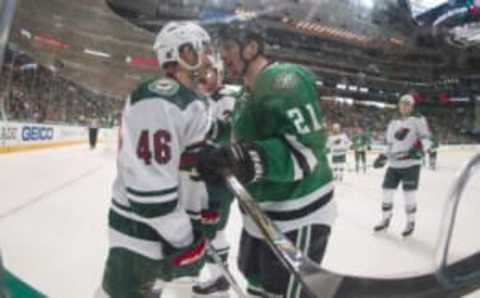 Apr 22, 2016; Dallas, TX, USA; Minnesota Wild defenseman Jared Spurgeon (46) and Dallas Stars left wing Antoine Roussel (21) exchange words during the second period in game five of the first round of the 2016 Stanley Cup Playoffs at the American Airlines Center. Mandatory Credit: Jerome Miron-USA TODAY Sports