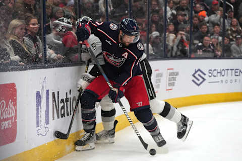 COLUMBUS, OHIO – DECEMBER 05: Sean Kuraly #7 of the Columbus Blue Jackets battles Andreas Englund #5 of the Los Angeles Kings for the puck along the boards during the second period at Nationwide Arena on December 05, 2023 in Columbus, Ohio. (Photo by Jason Mowry/Getty Images)