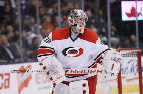 Feb 25, 2016; Toronto, Ontario, CAN; Carolina Hurricanes goaltender Cam Ward (30) during a break in the action against the Toronto Maple Leafs during the second period at the Air Canada Centre. Mandatory Credit: John E. Sokolowski-USA TODAY Sports