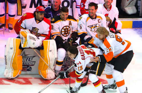 COLUMBUS, OH – JANUARY 24: Johnny Gaudreau #13 of the Calgary Flames and Team Toews gets guieded by Jakub Voracek #93 of the Philadelphia Flyers and Team Toews. (Photo by Kirk Irwin/Getty Images)